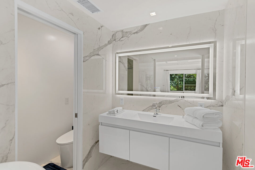 5949 Ramirez Canyon Road Malibu, CA 90265 - Photo 20 of 26 a bathroom with a sink and a toilet