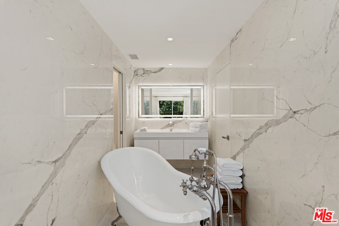 5949 Ramirez Canyon Road Malibu, CA 90265 - Photo 21 of 26 a bathroom with a sink and a mirror