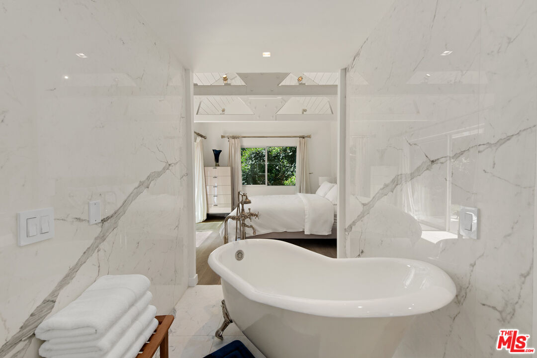 5949 Ramirez Canyon Road Malibu, CA 90265 - Photo 22 of 26 a bathroom with a sink and a bathtub
