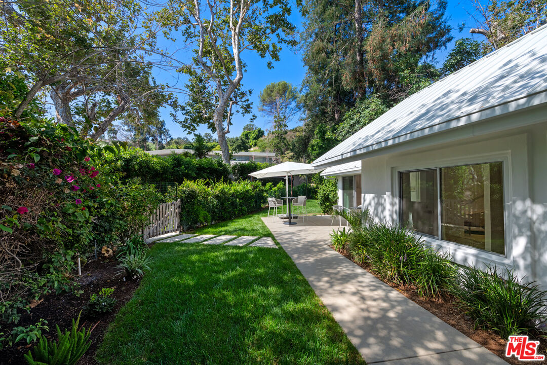 5949 Ramirez Canyon Road Malibu, CA 90265 - Photo 3 of 26 a front view of a house with a yard