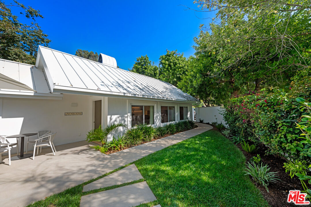 5949 Ramirez Canyon Road Malibu, CA 90265 - Photo 5 of 26 a front view of a house with garden