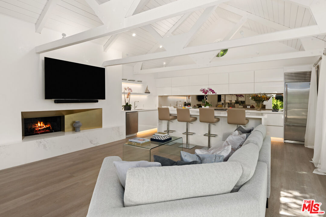 5949 Ramirez Canyon Road Malibu, CA 90265 - Photo 8 of 26 a living room with furniture and a flat screen tv
