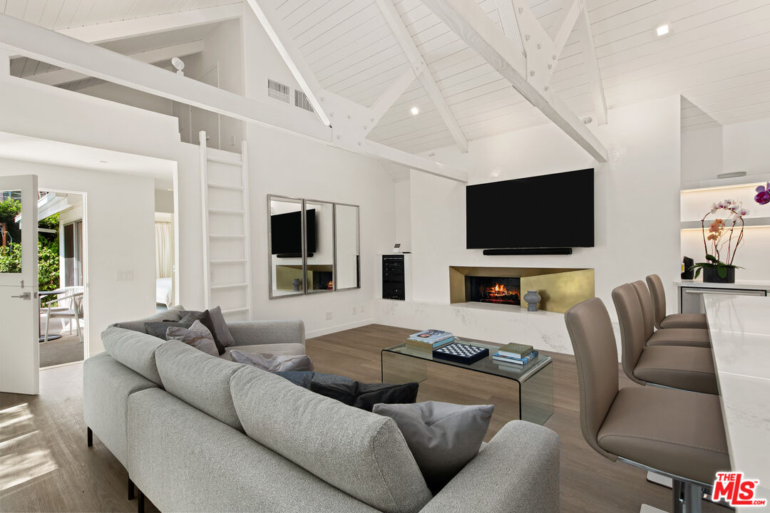 5949 Ramirez Canyon Road Malibu, CA 90265 - Photo 10 of 26 a living room with furniture and a flat screen tv