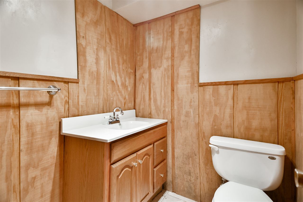118 North Elizabeth Scales Mound Road Elizabeth, IL 61028 - Photo 13 of 40 a bathroom with a toilet sink and mirror