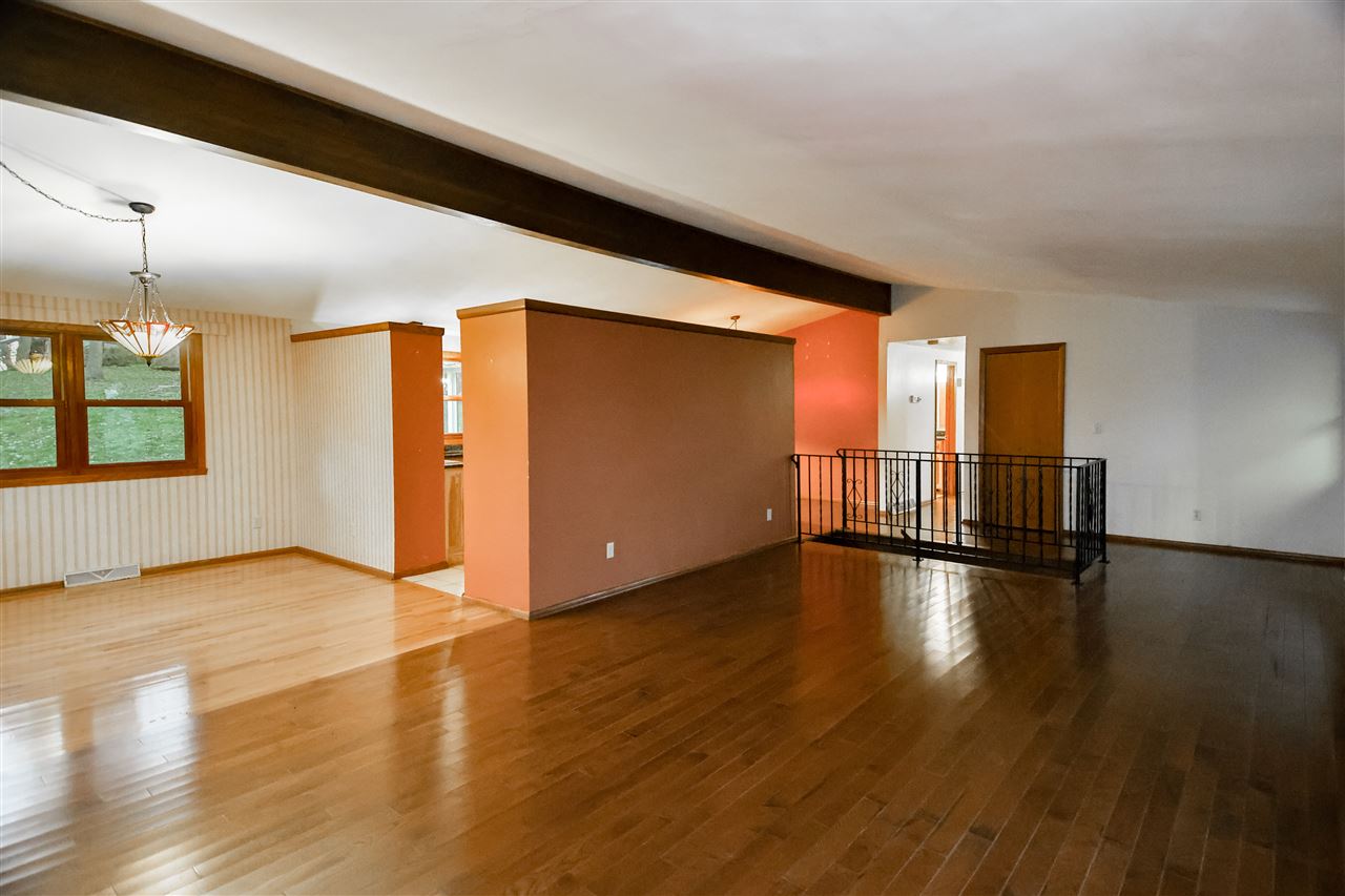 118 North Elizabeth Scales Mound Road Elizabeth, IL 61028 - Photo 15 of 40 a view of empty room with wooden floor and windows