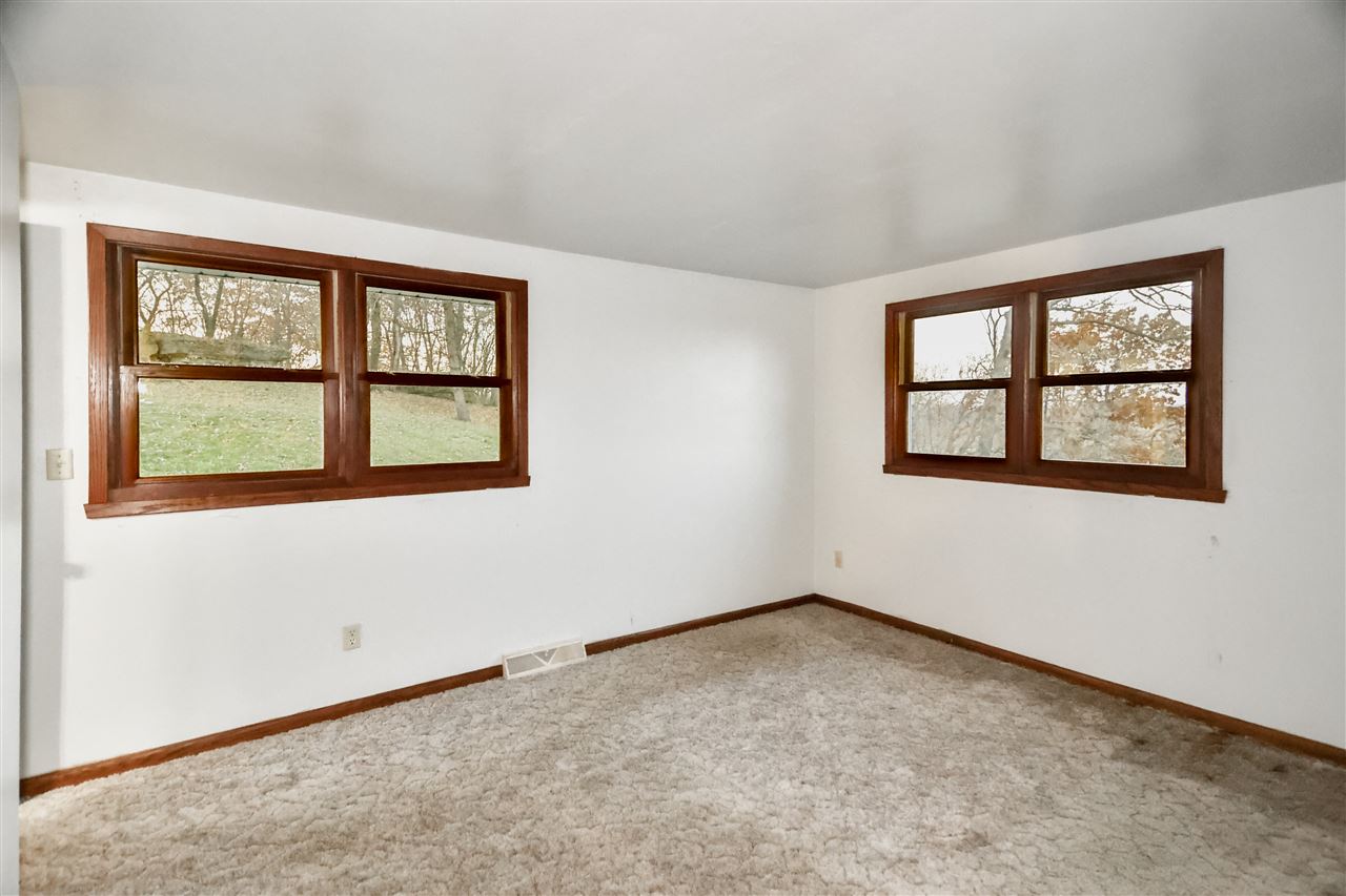 118 North Elizabeth Scales Mound Road Elizabeth, IL 61028 - Photo 25 of 40 a view of an empty room with a window