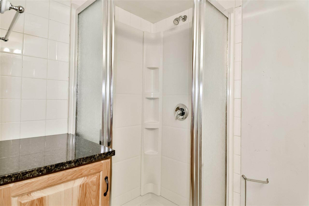 118 North Elizabeth Scales Mound Road Elizabeth, IL 61028 - Photo 29 of 40 a bathroom with a shower and a mirror