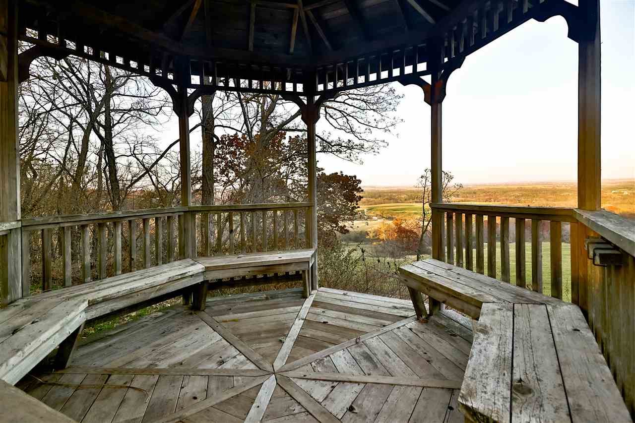 118 North Elizabeth Scales Mound Road Elizabeth, IL 61028 - Photo 40 of 40 a view of a balcony with wooden floor and outdoor seating