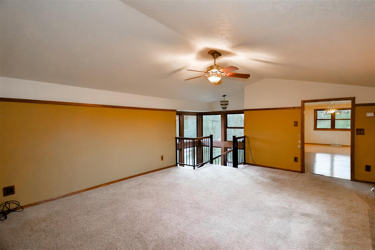 118 North Elizabeth Scales Mound Road Elizabeth, IL 61028 - Photo 7 of 40 wooden floor in an empty room with a window