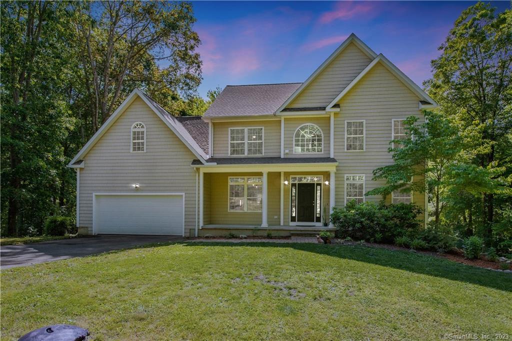 4 Ridge Valley Road Newtown, CT 06482 - Photo 1 of 1 a front view of a house with a garden