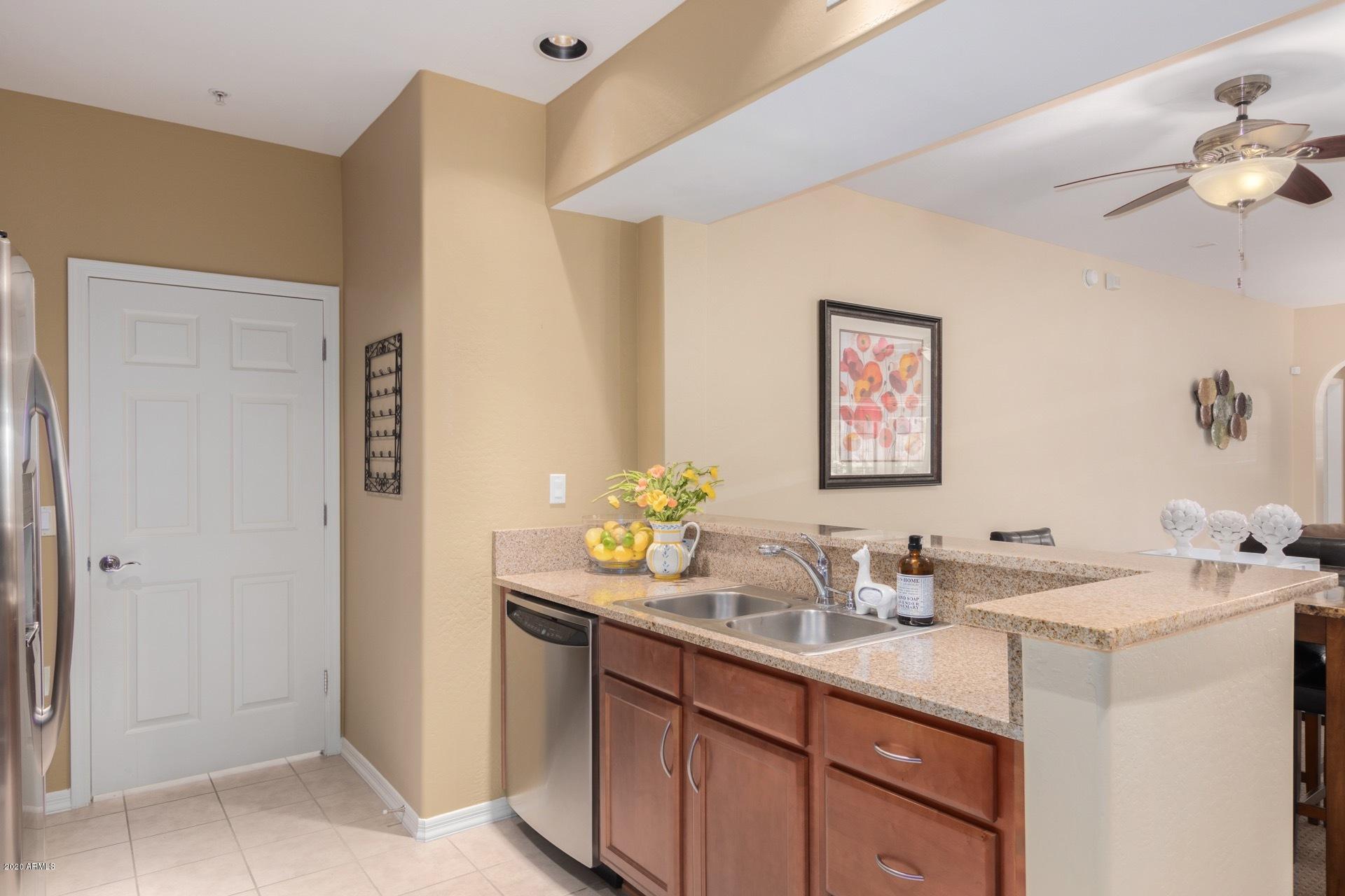 3935 East Rough Rider Road, Unit 1131 Phoenix, AZ 85050 - Photo 11 of 30 Full Laundry off Kitchen