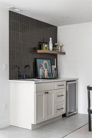 a kitchen with cabinets and window