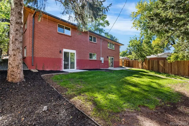 a backyard of a house with lots of green space