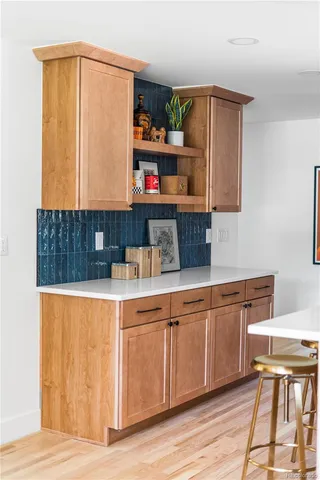 a kitchen with stainless steel appliances granite countertop a sink and cabinets