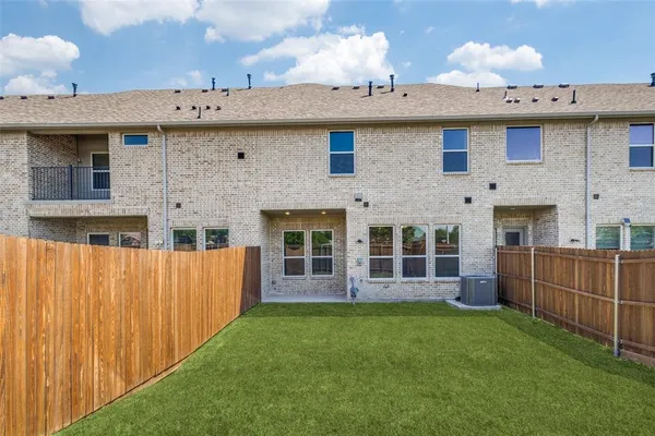 a view of a house with a garden and yard