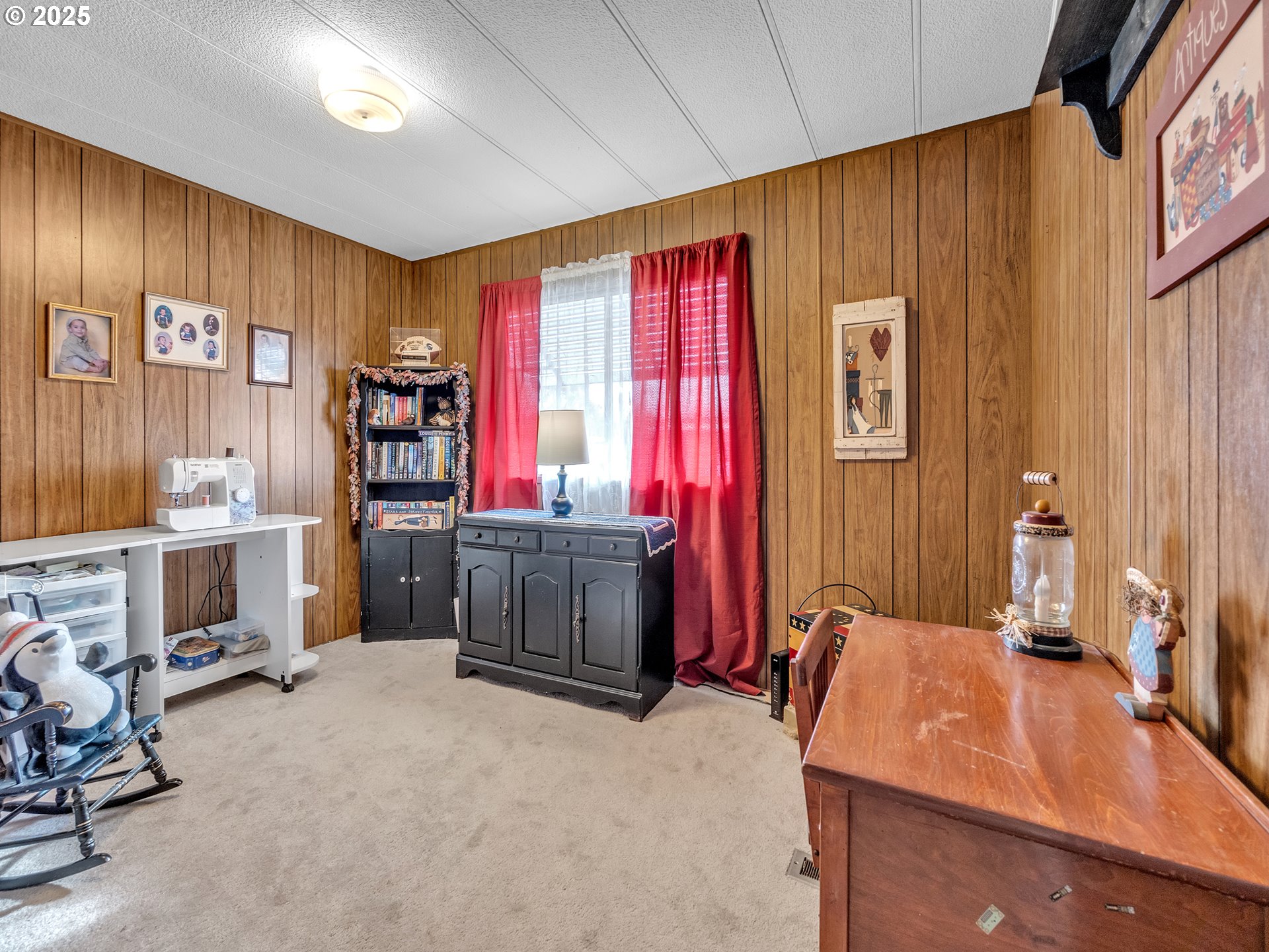 2902 East 2nd Street, Unit 98 Newberg, OR 97132 - Photo 19 of 25 a room with furniture a flat screen tv and a window