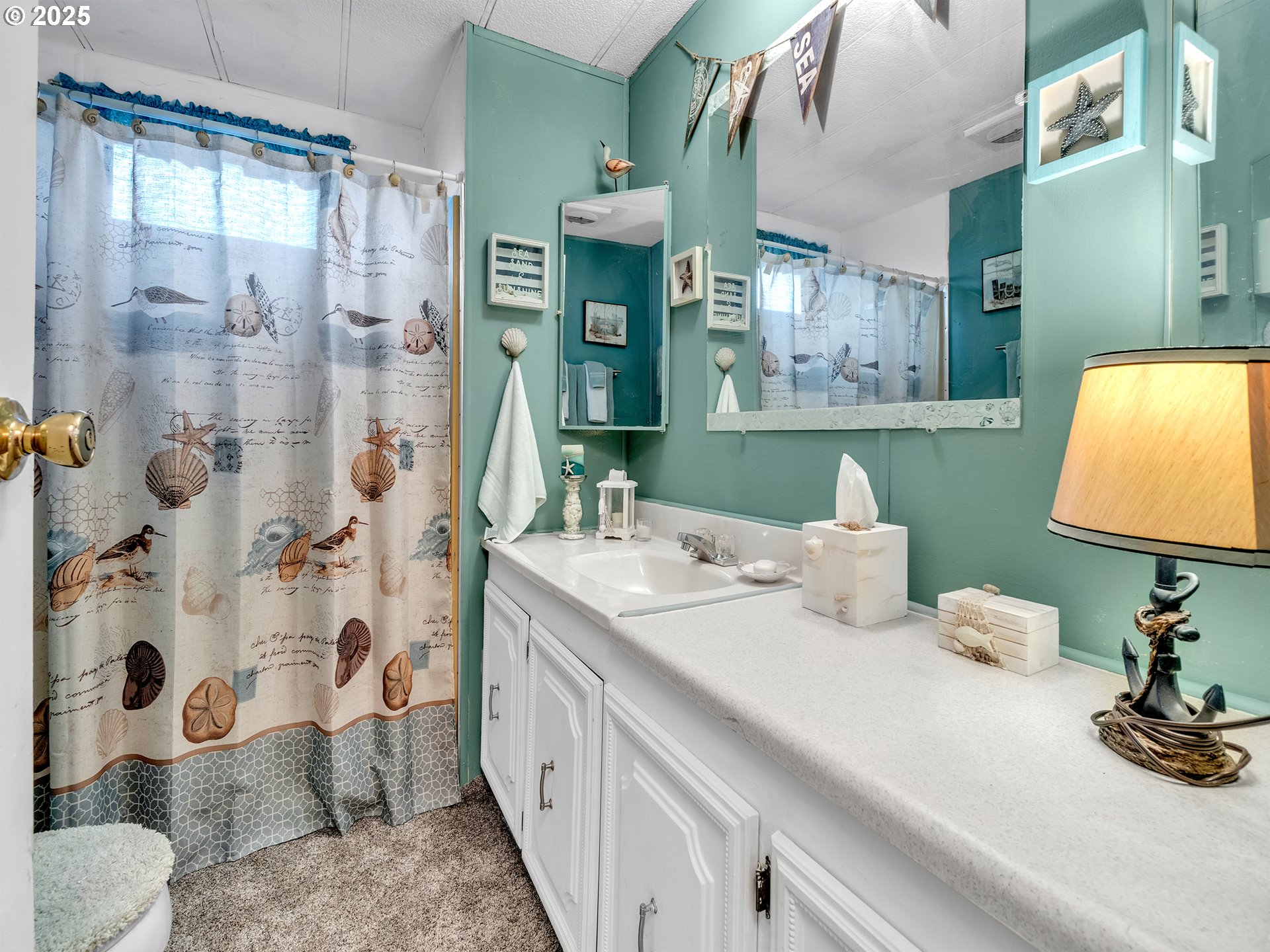 2902 East 2nd Street, Unit 98 Newberg, OR 97132 - Photo 20 of 25 a bathroom with a sink double vanity and a mirror