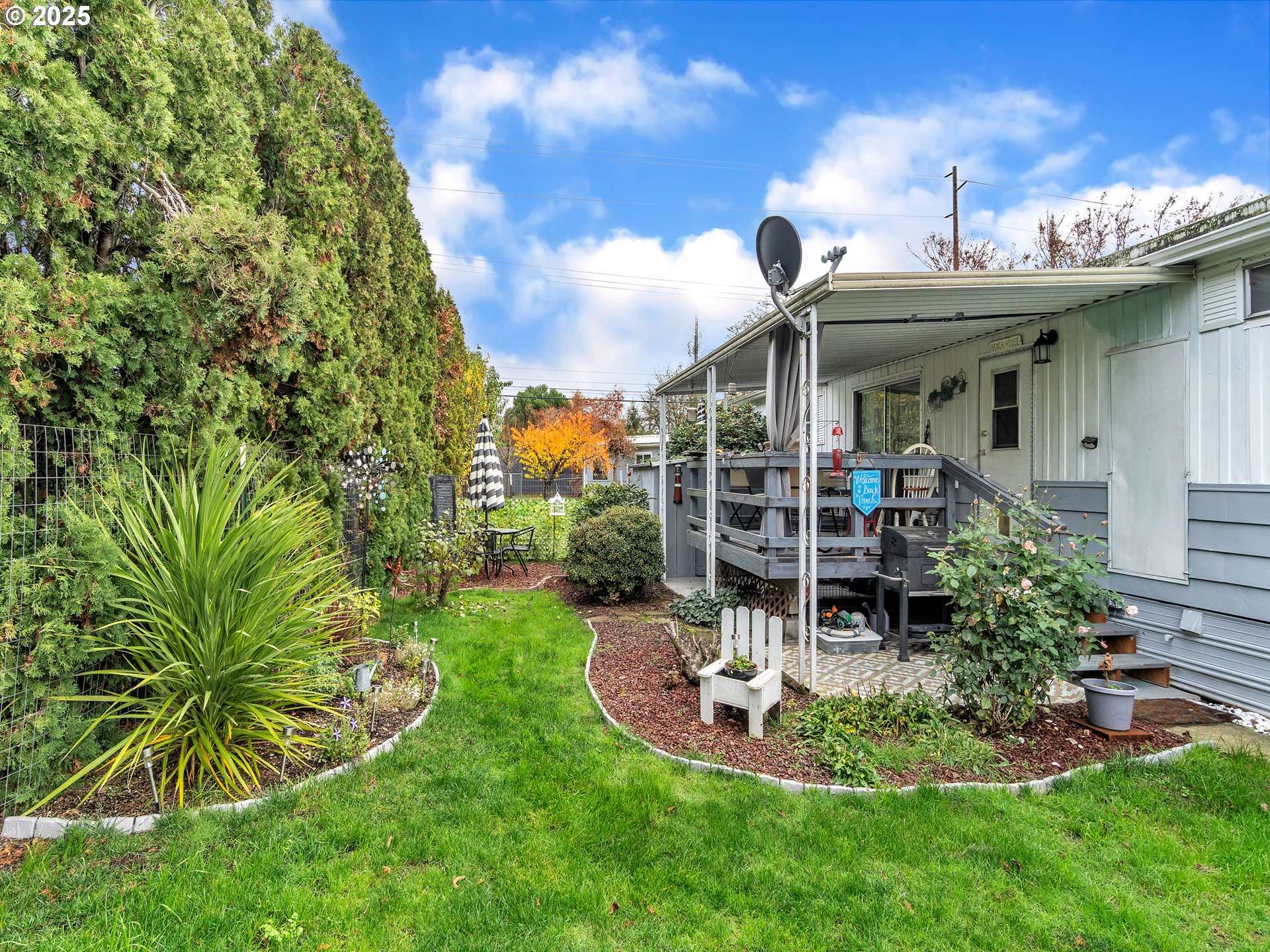 2902 East 2nd Street, Unit 98 Newberg, OR 97132 - Photo 22 of 25 a view of a house with a yard patio and furniture