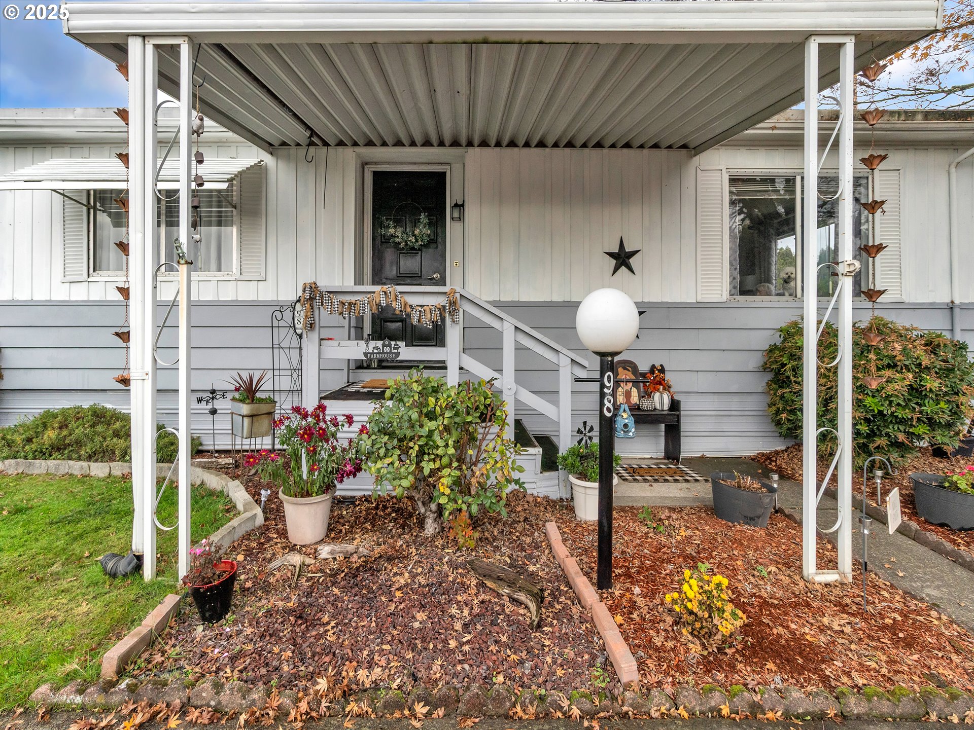 2902 East 2nd Street, Unit 98 Newberg, OR 97132 - Photo 4 of 25 a view of a chair and table in backyard of the house