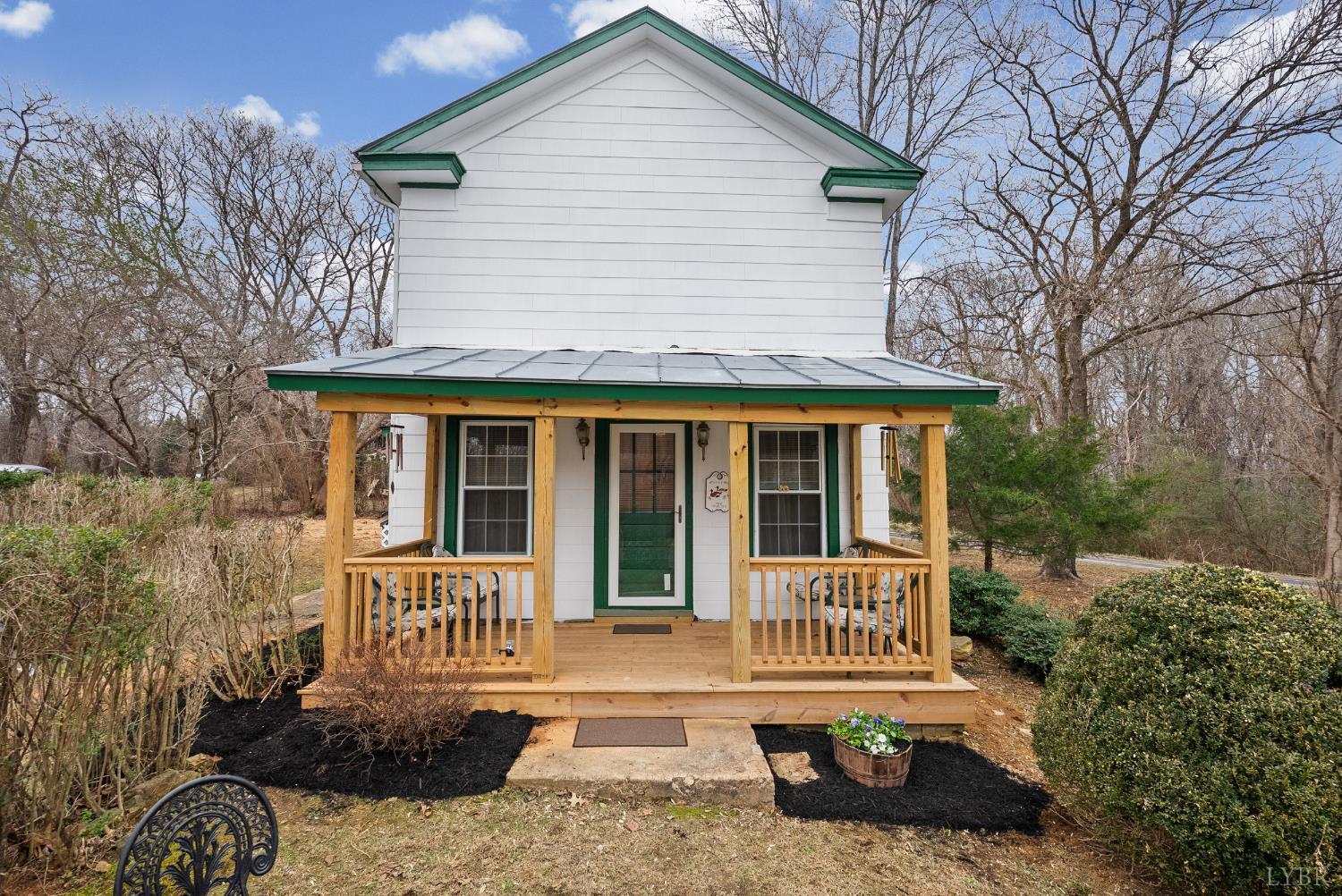 26 Braddock Lane Shipman, VA 22971 - Photo 1 of 37 a view of a house with a yard and potted plants