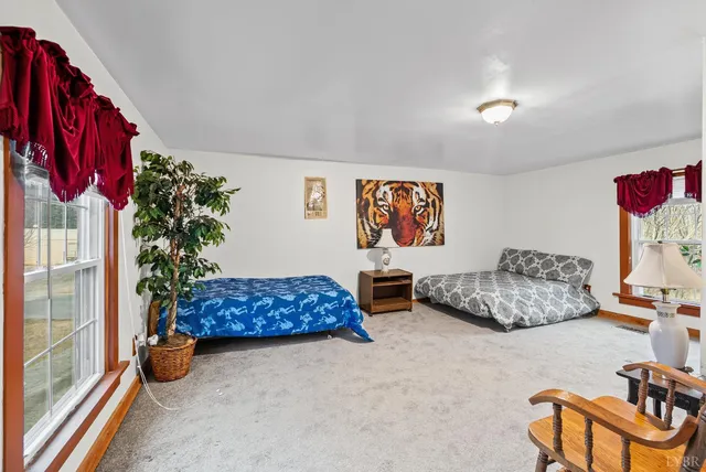 a bedroom with furniture and a bed