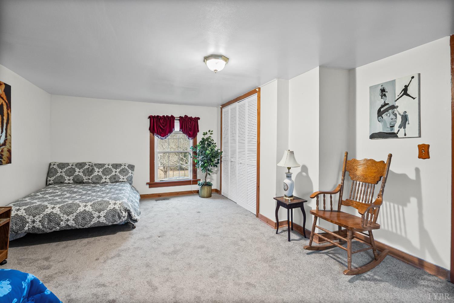 26 Braddock Lane Shipman, VA 22971 - Photo 20 of 37 a bedroom with furniture and a bed