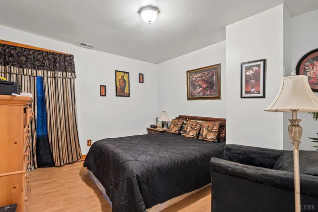 a bedroom with a bed and a dresser