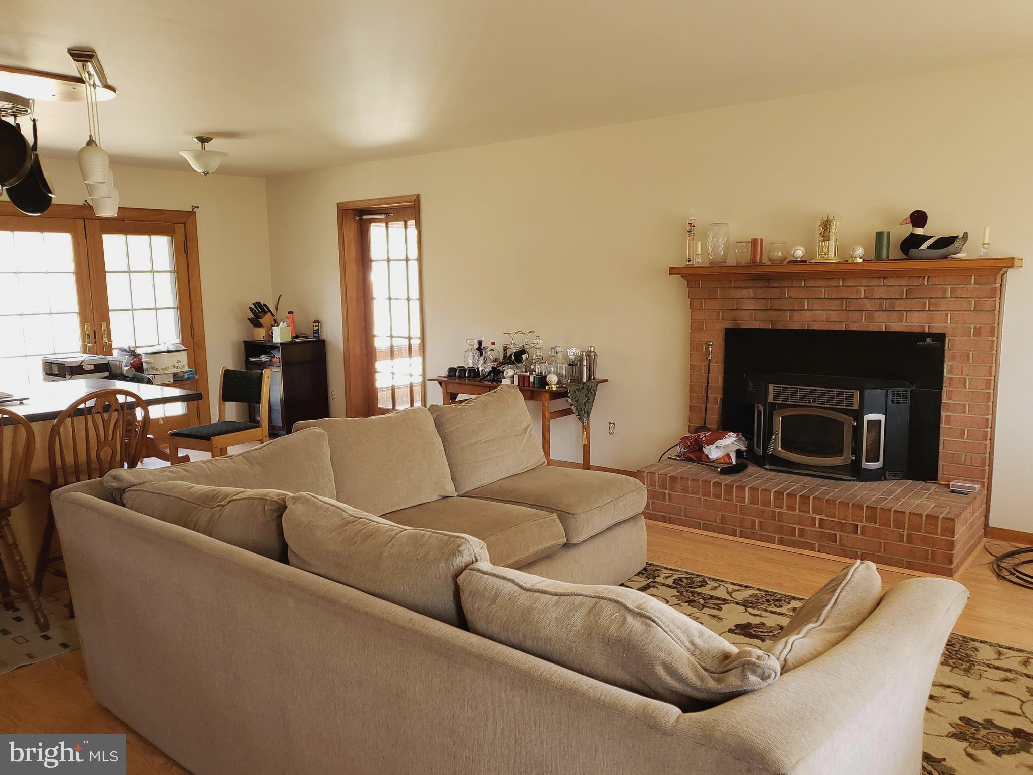 15605 Letcher Road Brandywine, MD 20613 - Photo 4 of 33 LIVING ROOM WITH PELLET STOVE