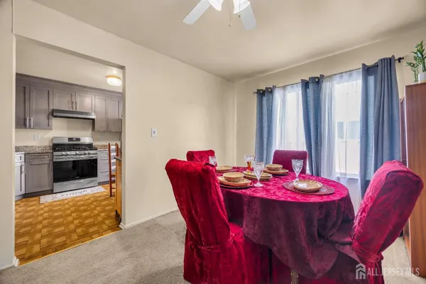 a dining room with furniture and window