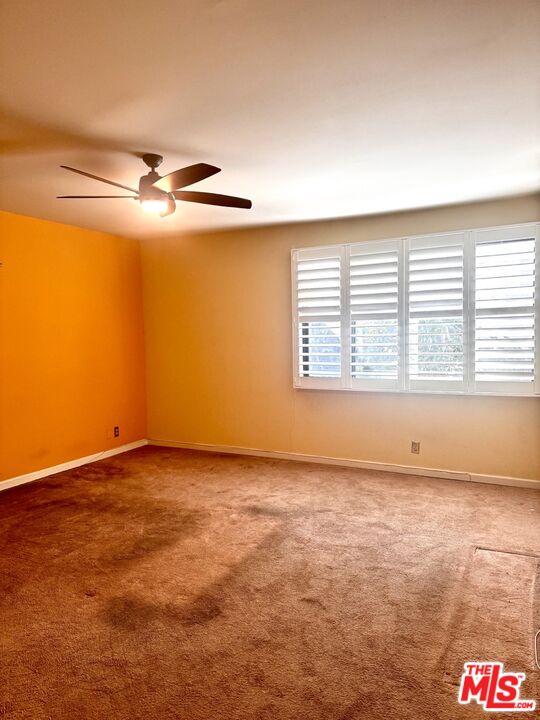 8455 Fountain Avenue, Unit 412 West Hollywood, CA 90069 - Photo 12 of 21 an empty room with windows