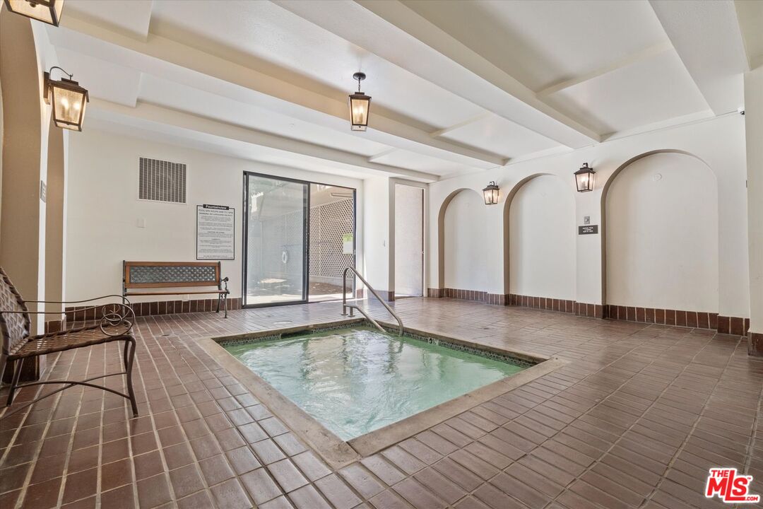 8455 Fountain Avenue, Unit 412 West Hollywood, CA 90069 - Photo 5 of 21 a view of a living room and bathroom