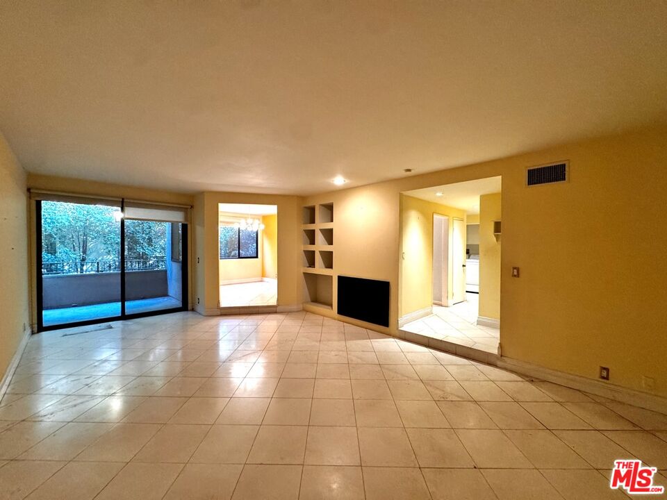 8455 Fountain Avenue, Unit 412 West Hollywood, CA 90069 - Photo 9 of 21 a view of an empty room with window and cabinet