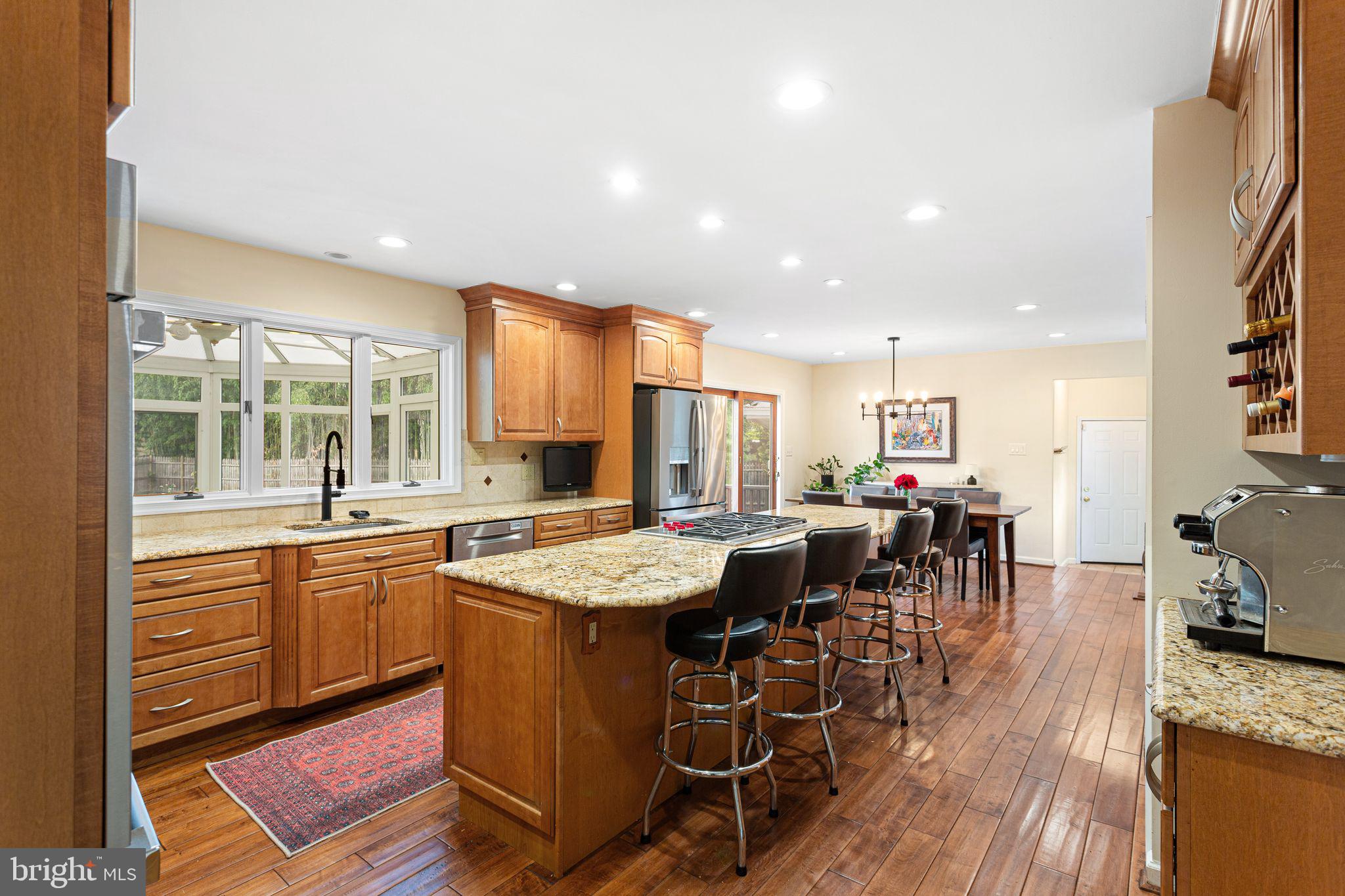 51 Chestnut Street Haddonfield, NJ 08033 - Photo 15 of 56 a dining hall with stainless steel appliances granite countertop a stove and a sink