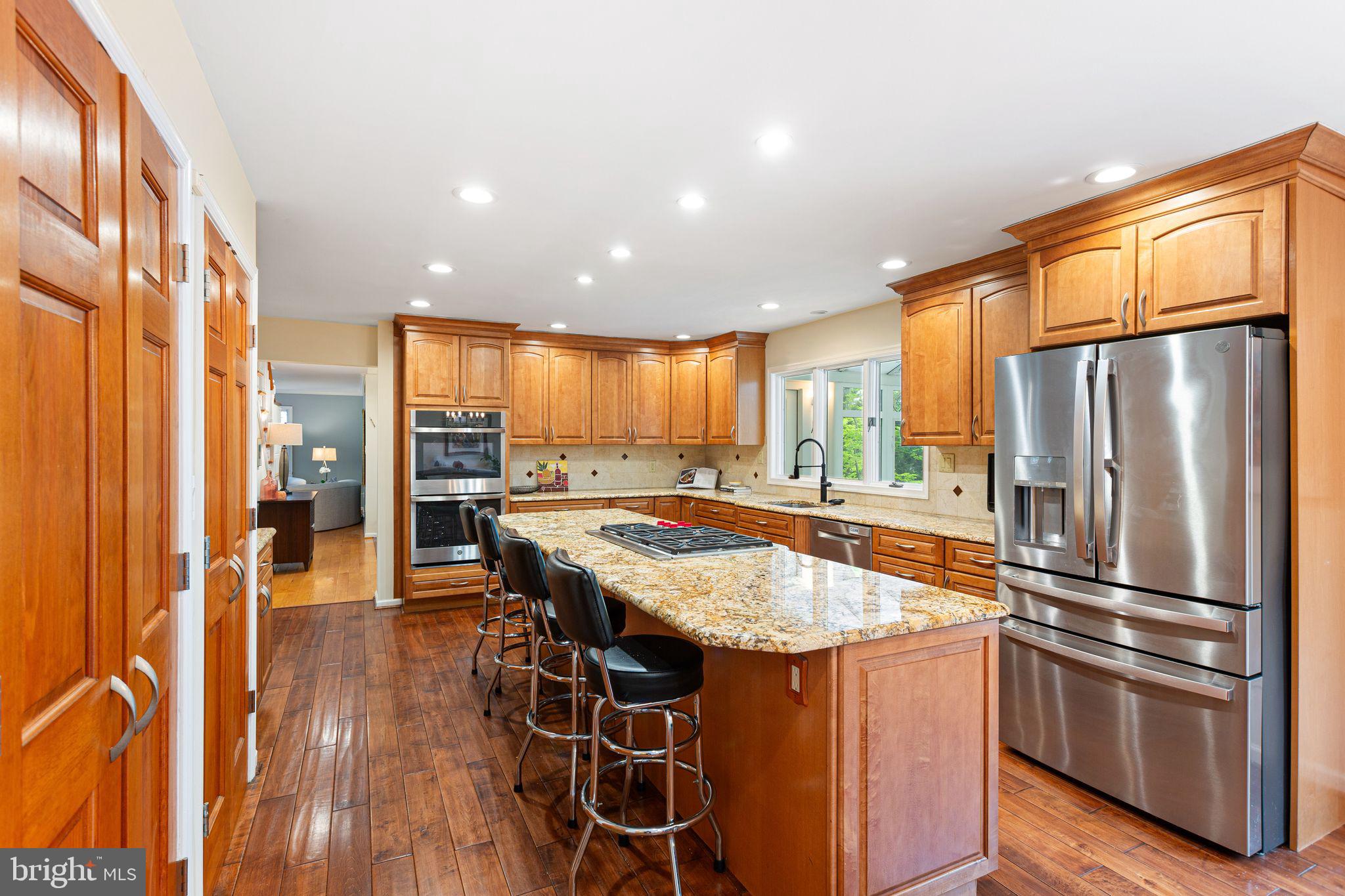 51 Chestnut Street Haddonfield, NJ 08033 - Photo 17 of 56 a kitchen with stainless steel appliances granite countertop a refrigerator a stove and a wooden floor