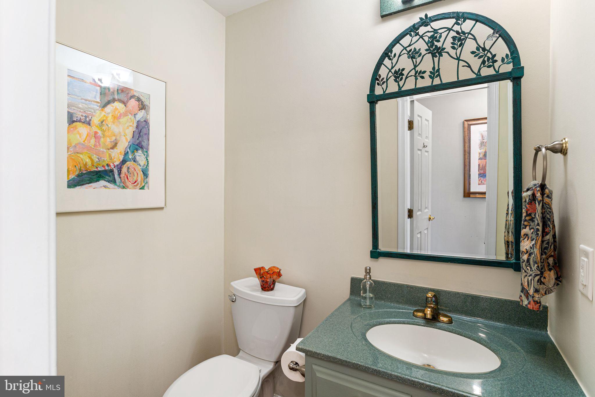 51 Chestnut Street Haddonfield, NJ 08033 - Photo 24 of 56 a bathroom with a toilet a sink and a mirror