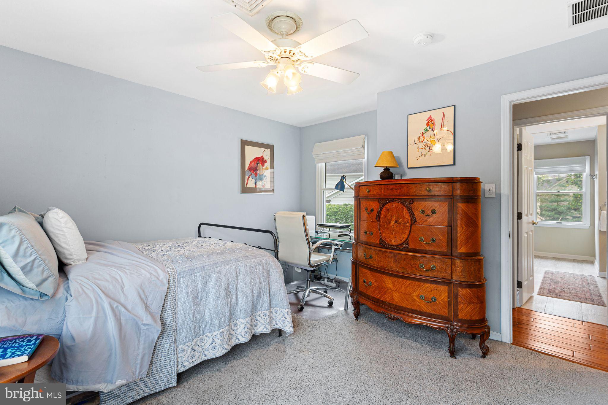51 Chestnut Street Haddonfield, NJ 08033 - Photo 31 of 56 a bedroom with a bed and a chandelier
