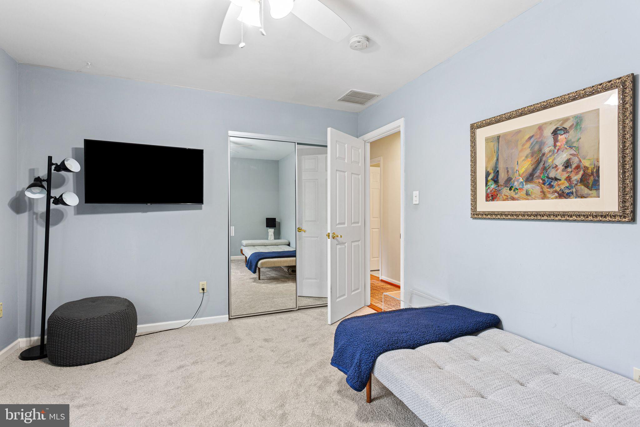 51 Chestnut Street Haddonfield, NJ 08033 - Photo 36 of 56 a bedroom with a bed and a flat screen tv