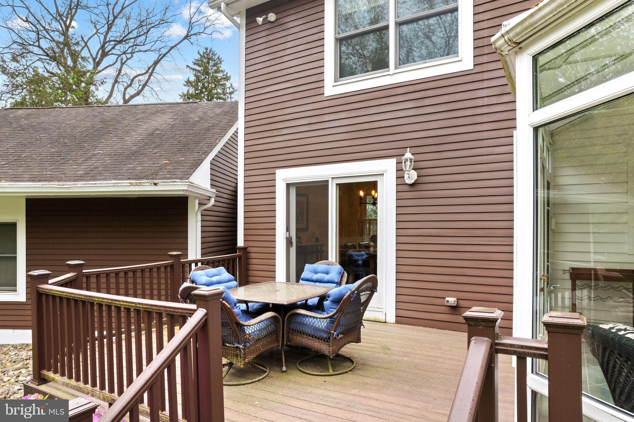 51 Chestnut Street Haddonfield, NJ 08033 - Photo 47 of 56 a view of backyard with outdoor seating and wooden floor