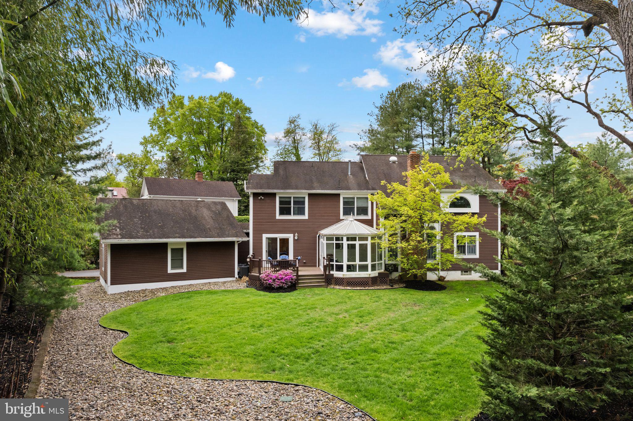 51 Chestnut Street Haddonfield, NJ 08033 - Photo 6 of 56 a front view of a house with a garden and deck