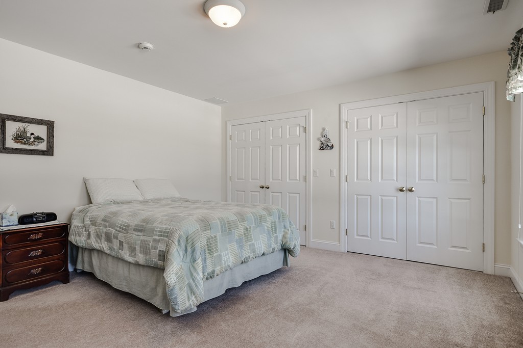 32 Fieldstone Farm Road Sudbury, MA 01776 - Photo 18 of 30 a spacious bedroom with a bed and a cabinets