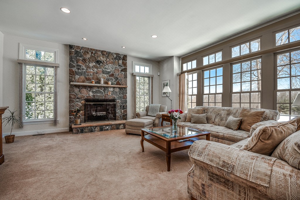 32 Fieldstone Farm Road Sudbury, MA 01776 - Photo 7 of 30 a living room with furniture and a fireplace