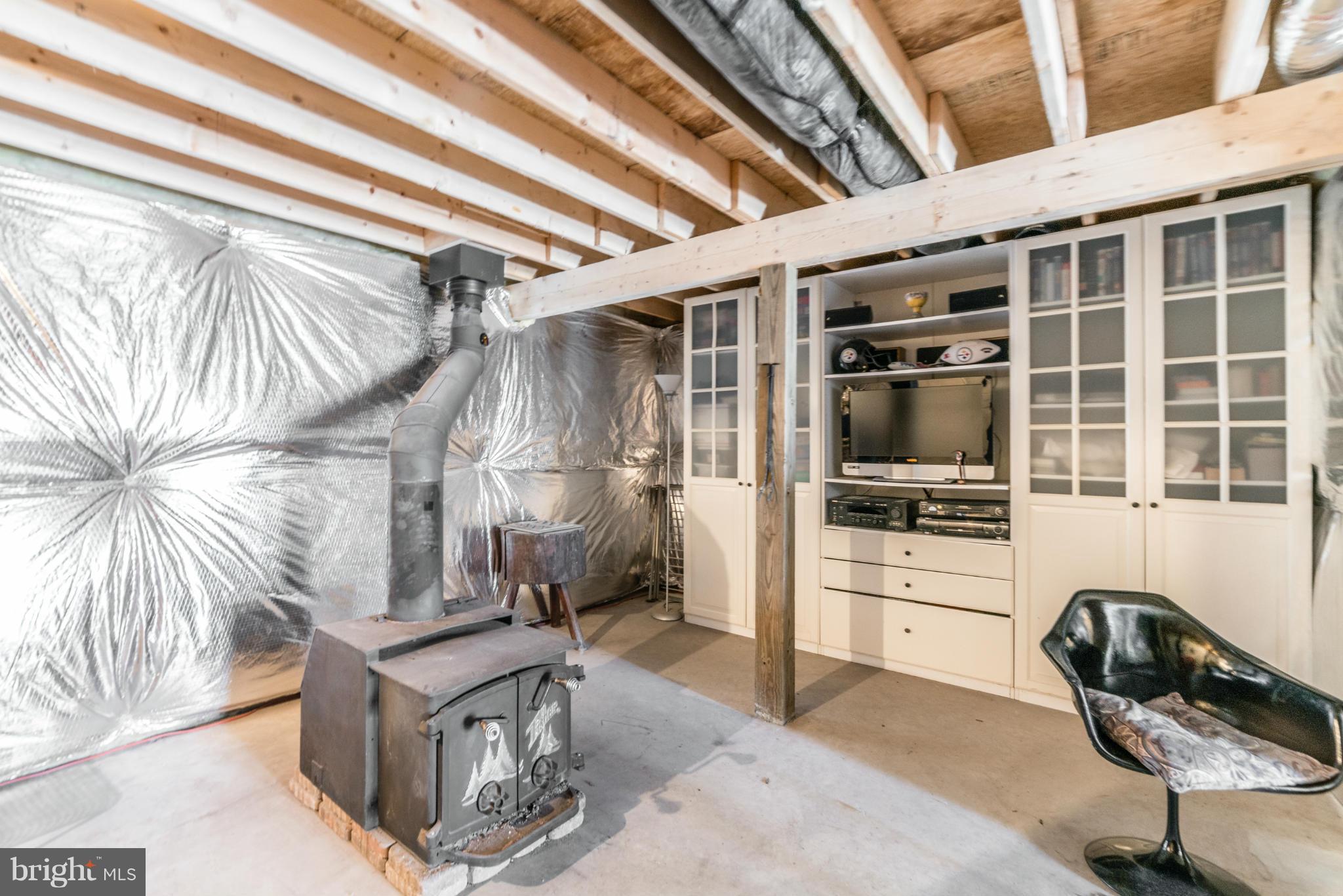 227 Markham Farm Road Front Royal, VA 22630 - Photo 21 of 25 Basement has wood stove and plenty of space