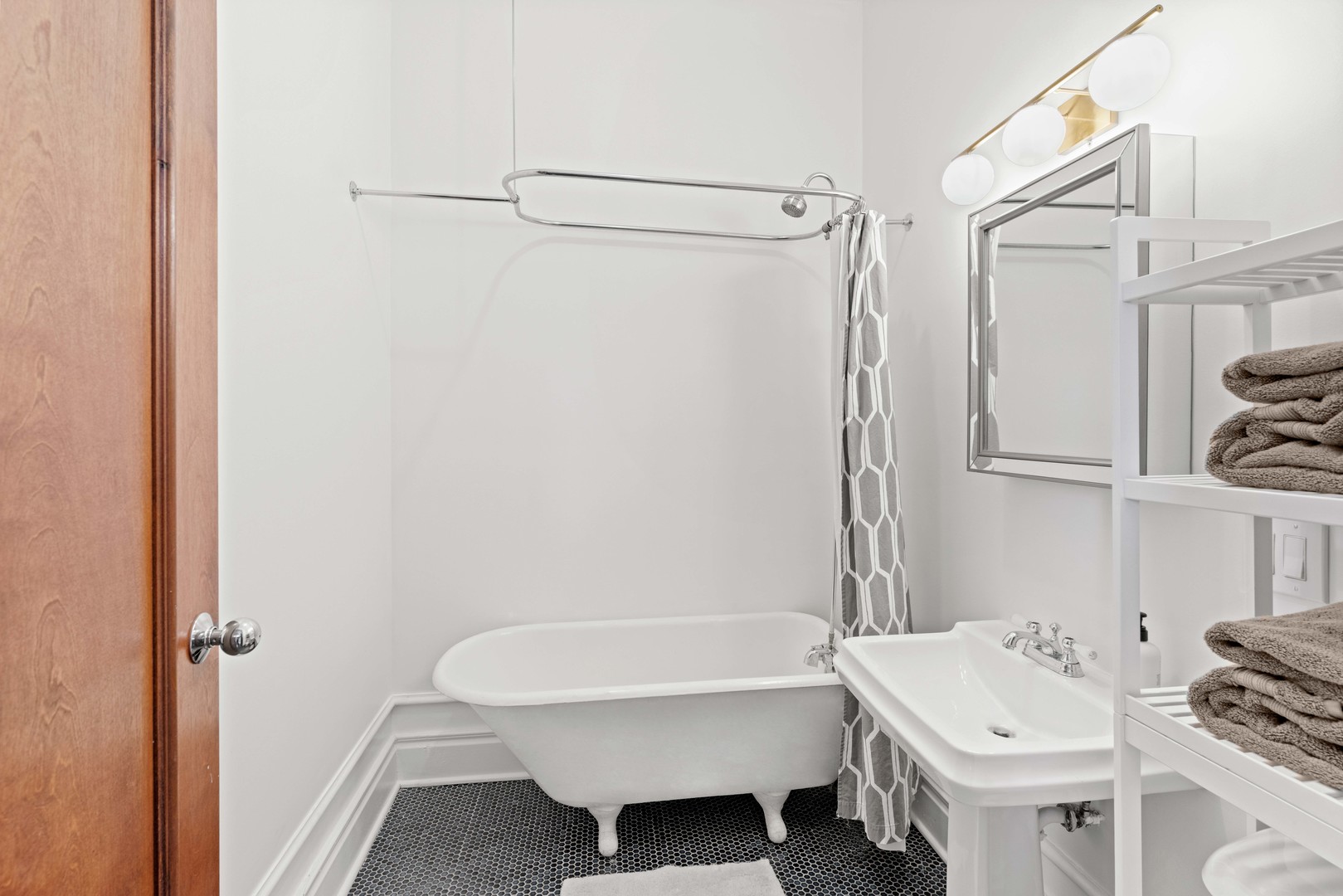 1400 West Chestnut Street, Unit 1 Chicago, IL 60642 - Photo 13 of 24 a bathroom with a sink toilet and shower