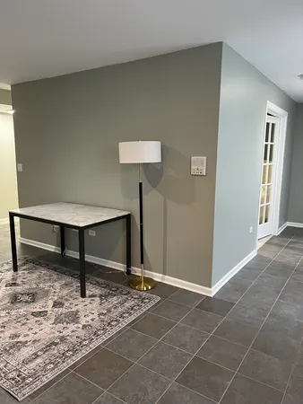 a living room with furniture and a rug