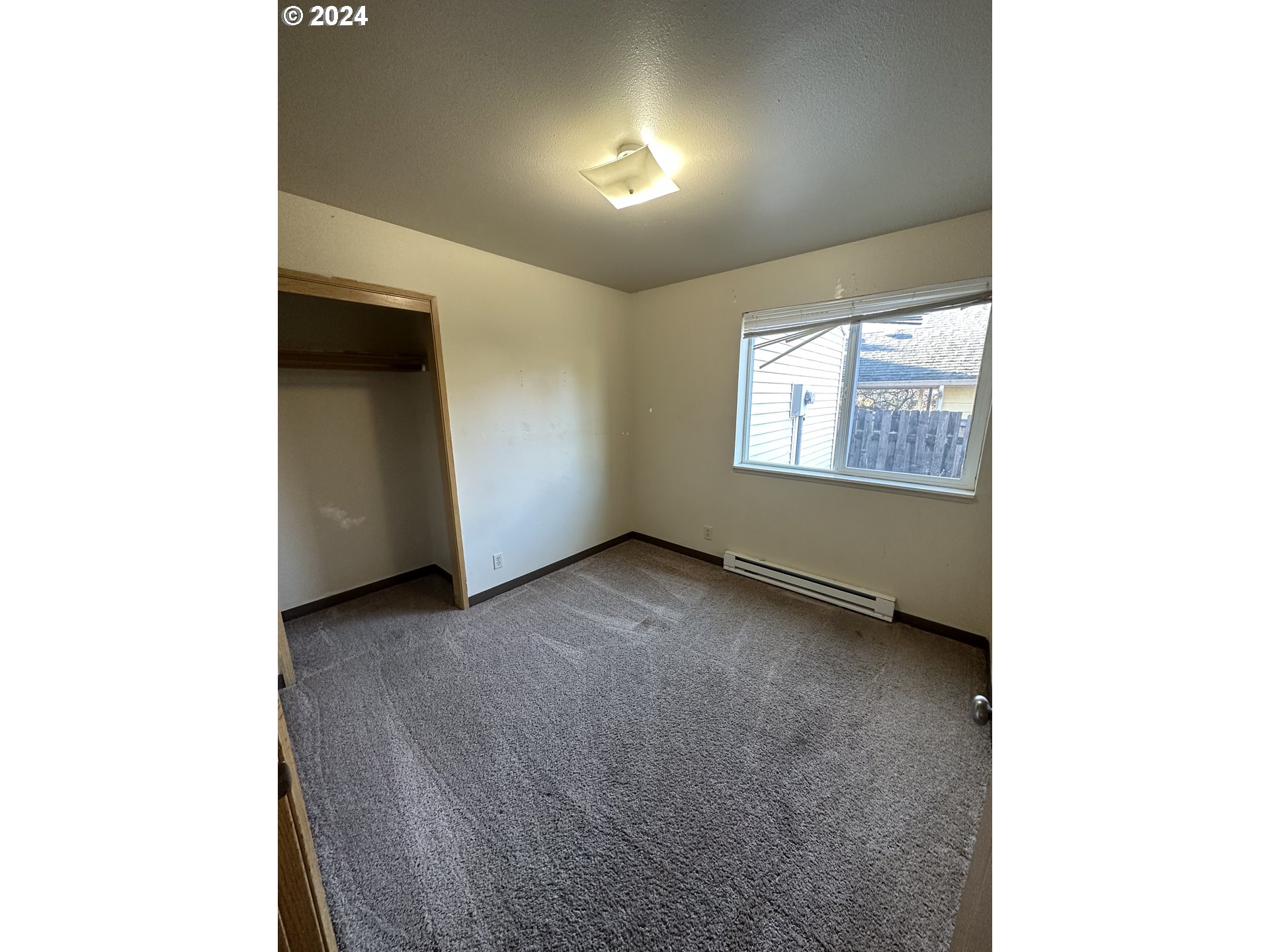 906-908 Pioneer Street Ridgefield, WA 98642 - Photo 11 of 19 a view of an empty room with a window