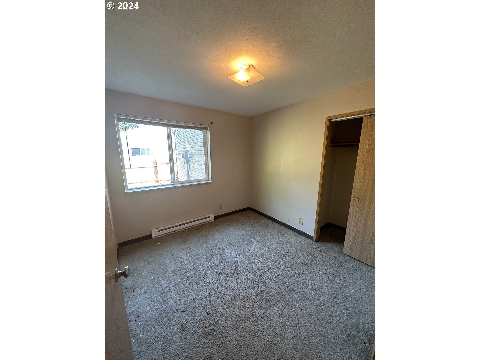 906-908 Pioneer Street Ridgefield, WA 98642 - Photo 17 of 19 a view of an empty room with a window
