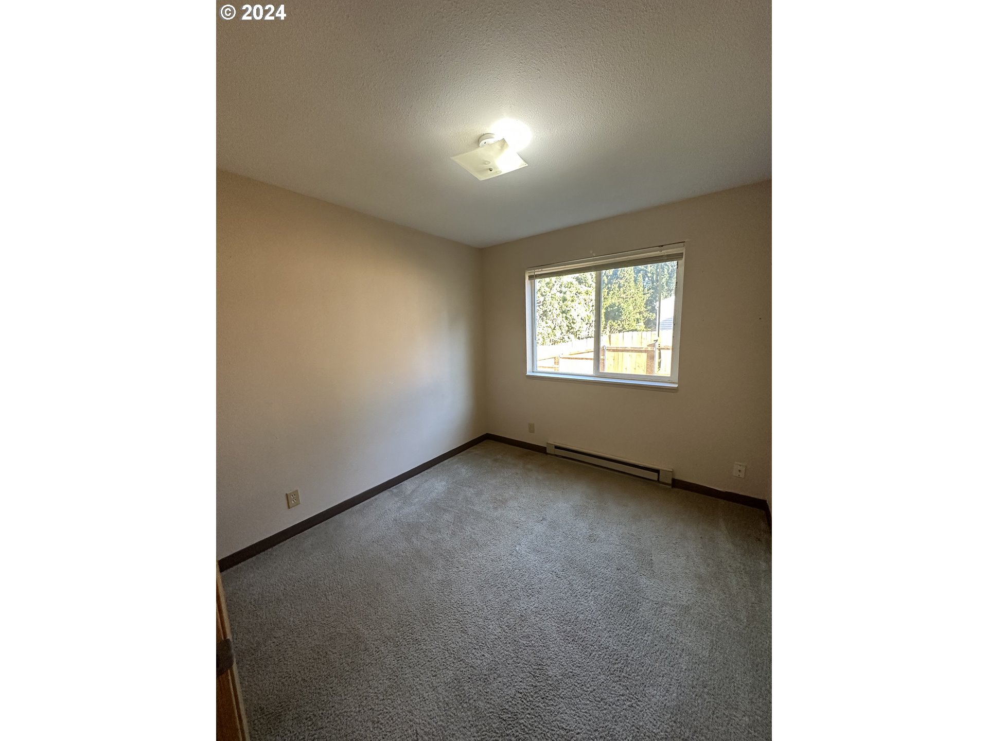 906-908 Pioneer Street Ridgefield, WA 98642 - Photo 18 of 19 a view of an empty room with a window