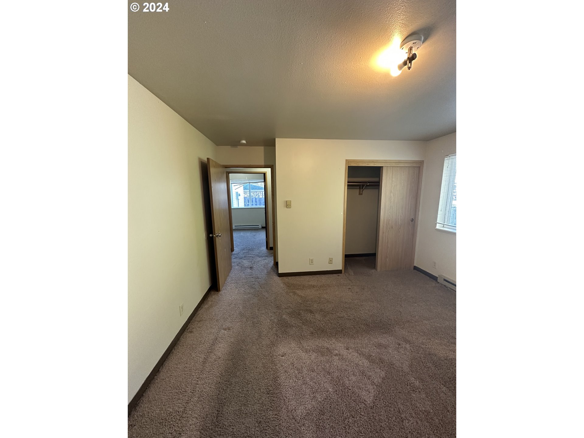 906-908 Pioneer Street Ridgefield, WA 98642 - Photo 8 of 19 a view of an empty room with closet and a window