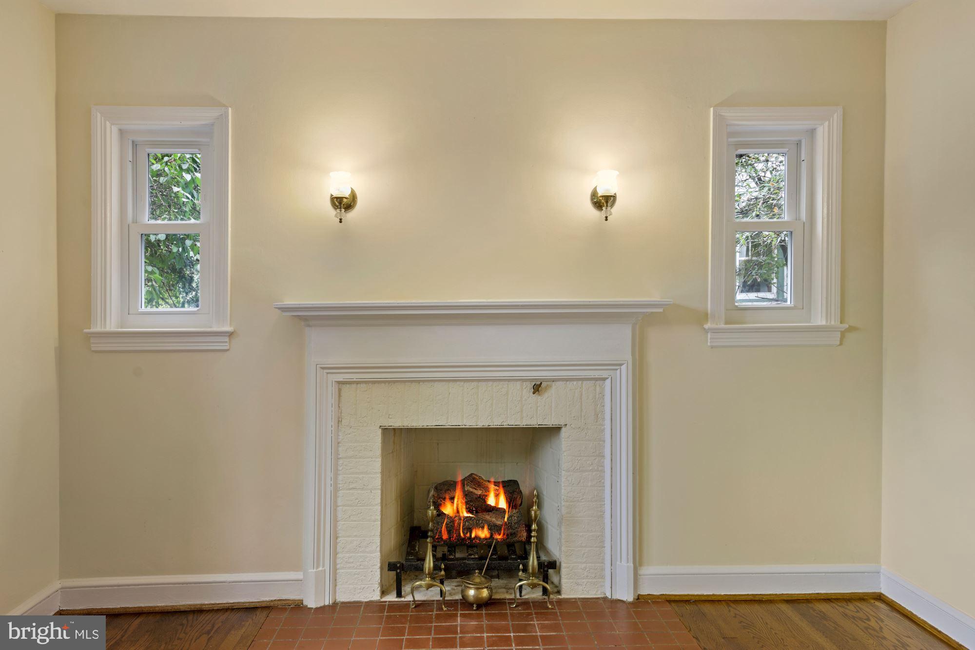 8106 Piney Branch Road Silver Spring, MD 20910 - Photo 5 of 39 fireplace with sidelight windows and sconces