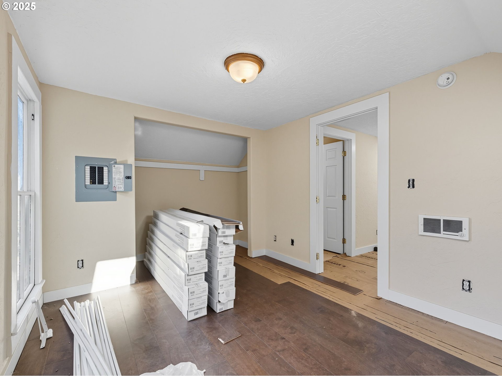 686 29th Street Astoria, OR 97103 - Photo 14 of 48 a view of an empty room with wooden floor and a window